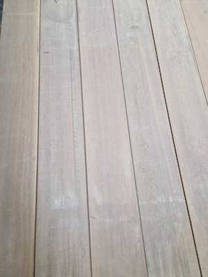 Close-up view of smooth, evenly spaced wooden planks with a light natural finish