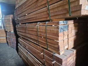 Bundles of uniformly cut timber planks tightly strapped and stacked in a warehouse